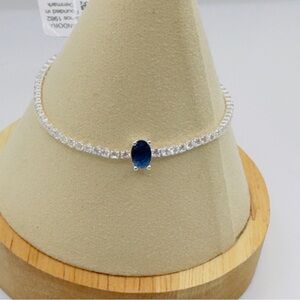 Authentic Pandora sparkling pave tennis bracelet with blue oval center